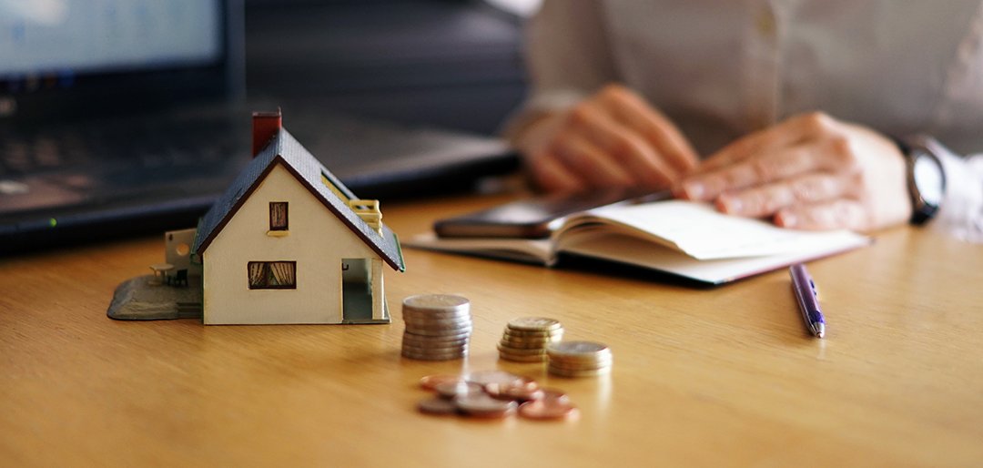 Closeup shot of a person thinking of buying or selling a house