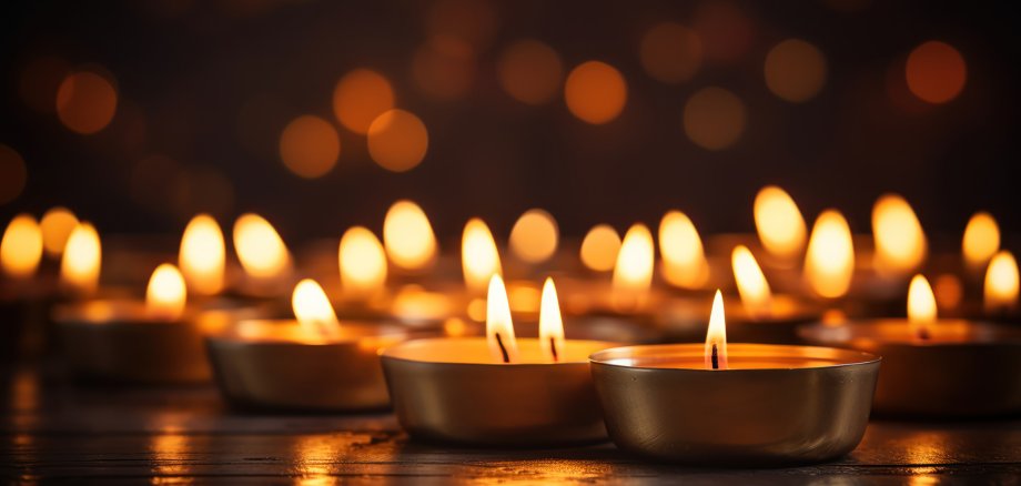 Soft candlelight flickering against a dark background
